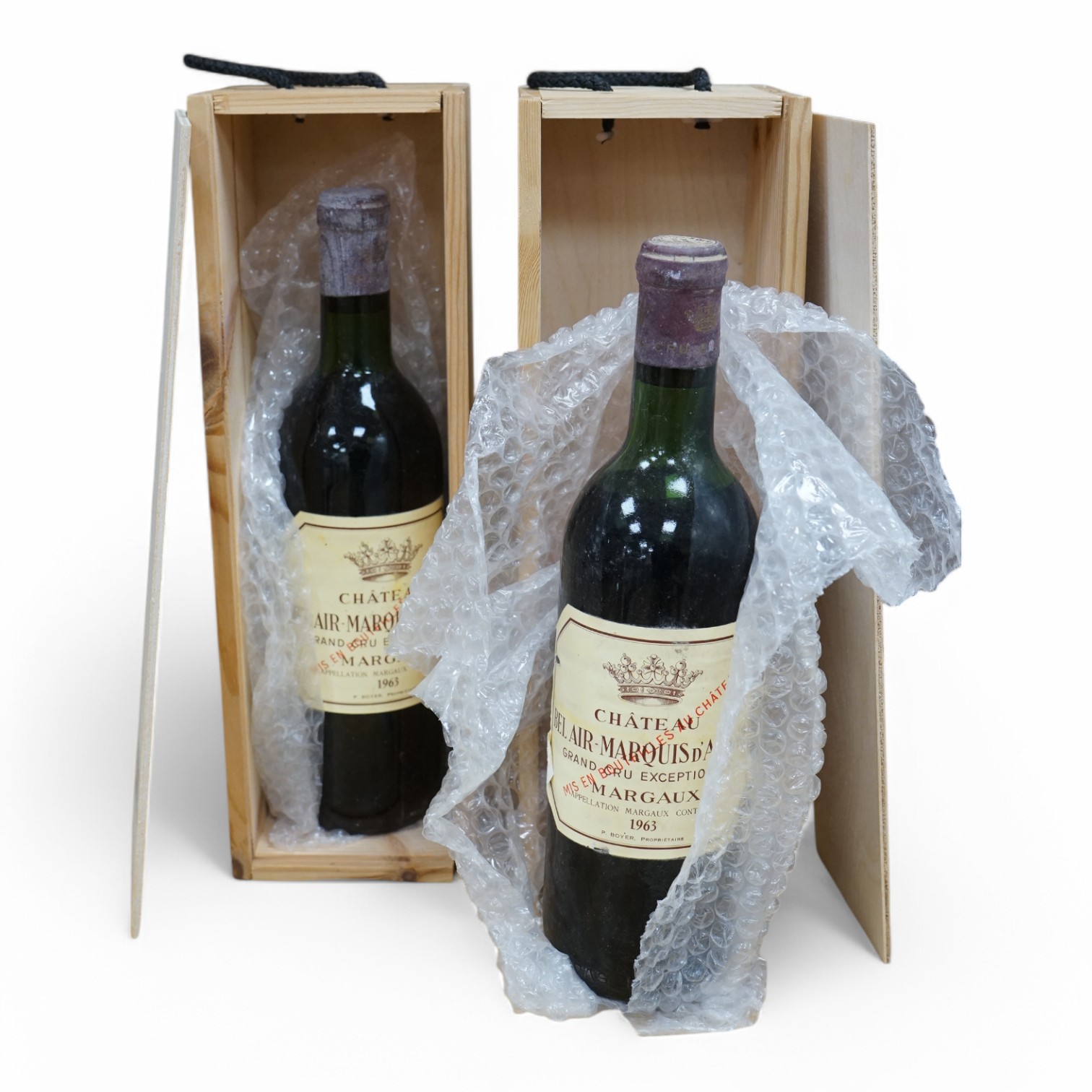 Two cased bottles of Chateau Bel-Air Marquis d'Aigre, 1963. Condition - good